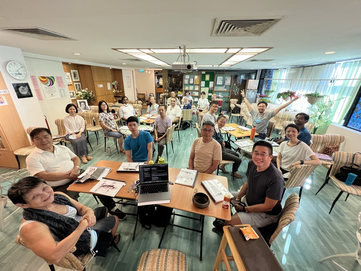 Group gathered around tables in a meeting room