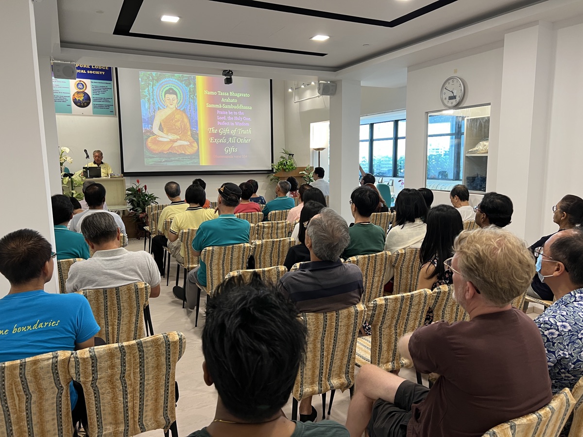 Audience seated during a talk at the Singapore Lodge